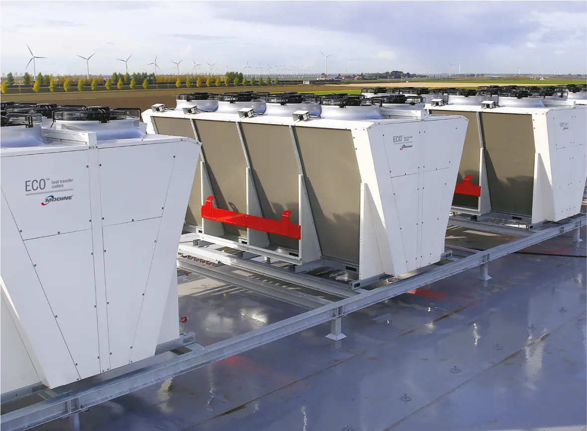 ECO heat transfer coolers by Modine installed outdoors with wind turbines in the background